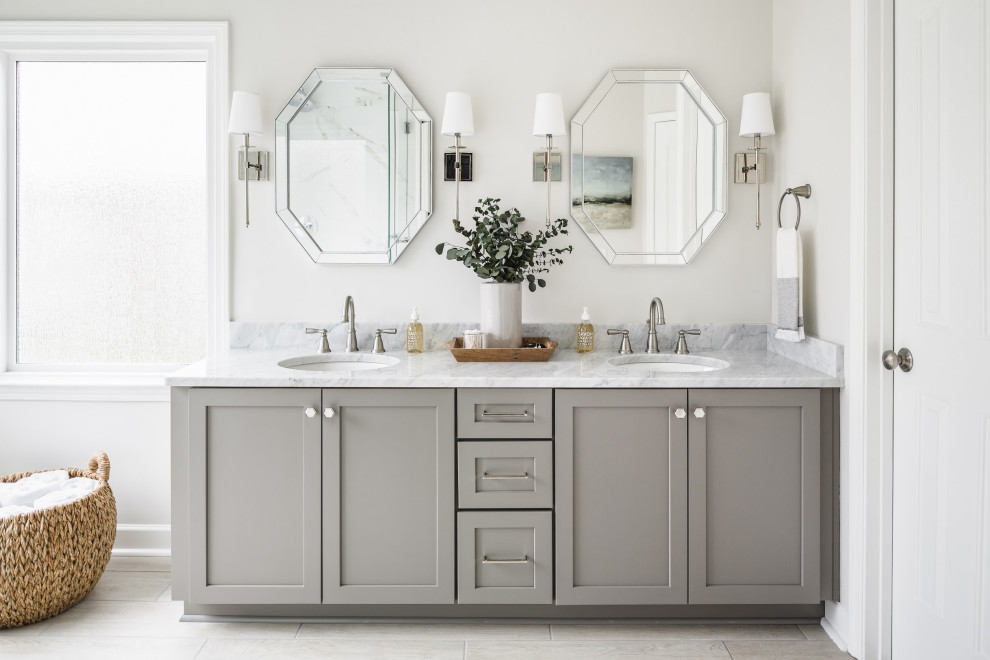 This is an example of a transitional bathroom in Charlotte with shaker cabinets, grey cabinets, grey walls, an undermount sink, grey floor, grey benchtops, a double vanity and a built-in vanity.