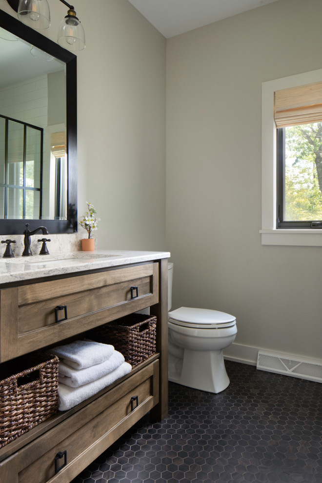 This is an example of a mid-sized transitional 3/4 bathroom in Milwaukee with shaker cabinets, medium wood cabinets, a double shower, a two-piece toilet, black and white tile, ceramic tile, grey walls, ceramic floors, an undermount sink, engineered quartz benchtops, black floor, a hinged shower door, white benchtops, a single vanity and a freestanding vanity.