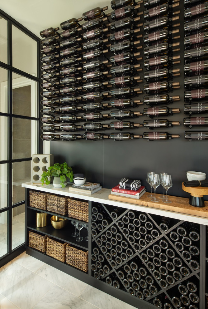 Example of a mid-sized minimalist ceramic tile and multicolored floor wine cellar design in Phoenix with storage racks