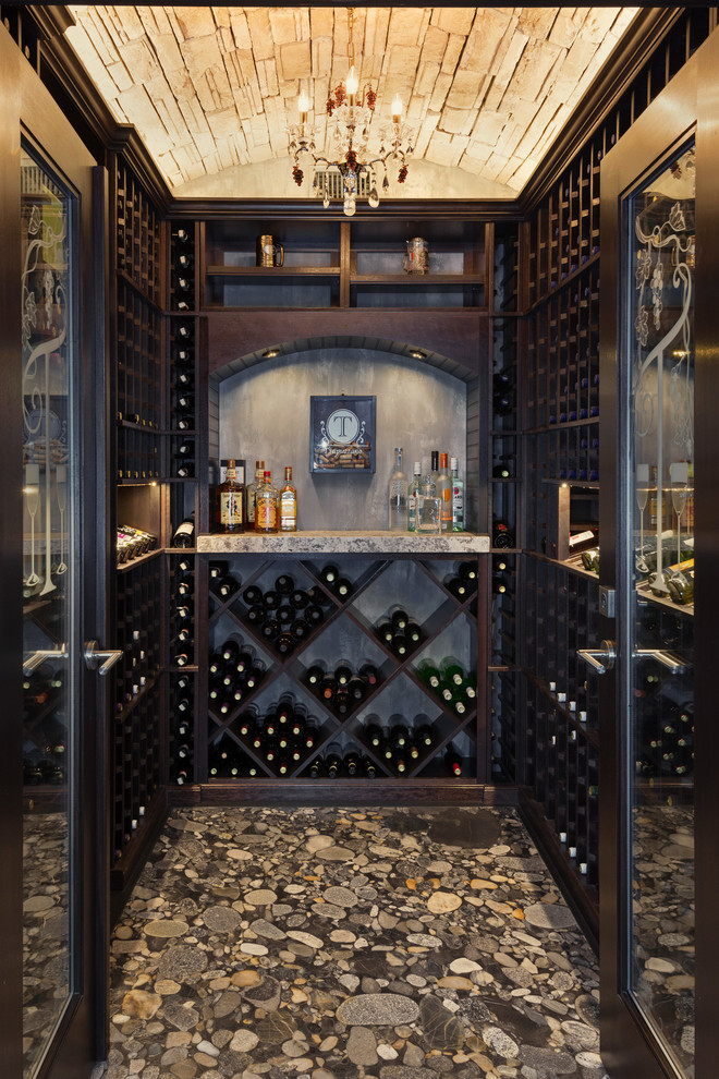 Photo of a traditional wine cellar in Other with diamond bins.