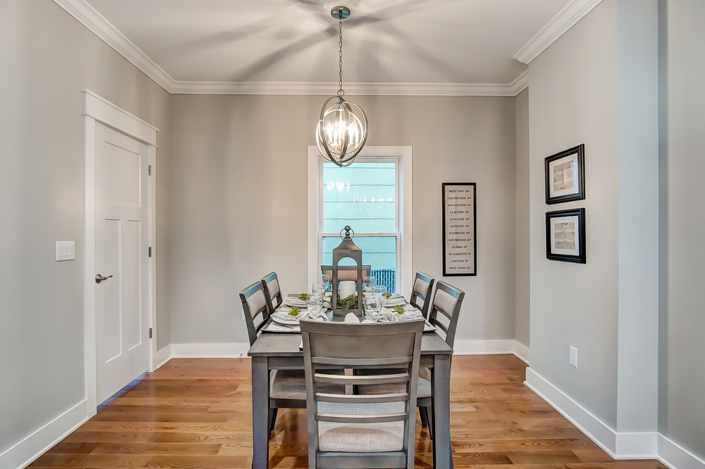 Inspiration for a transitional separate dining room in Columbus with grey walls, medium hardwood floors and brown floor.