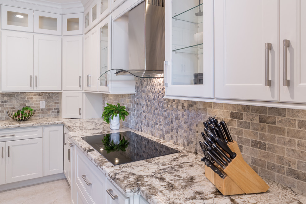 Example of a large transitional l-shaped open concept kitchen design in Miami with an undermount sink, flat-panel cabinets, white cabinets, quartzite countertops, multicolored backsplash and an island