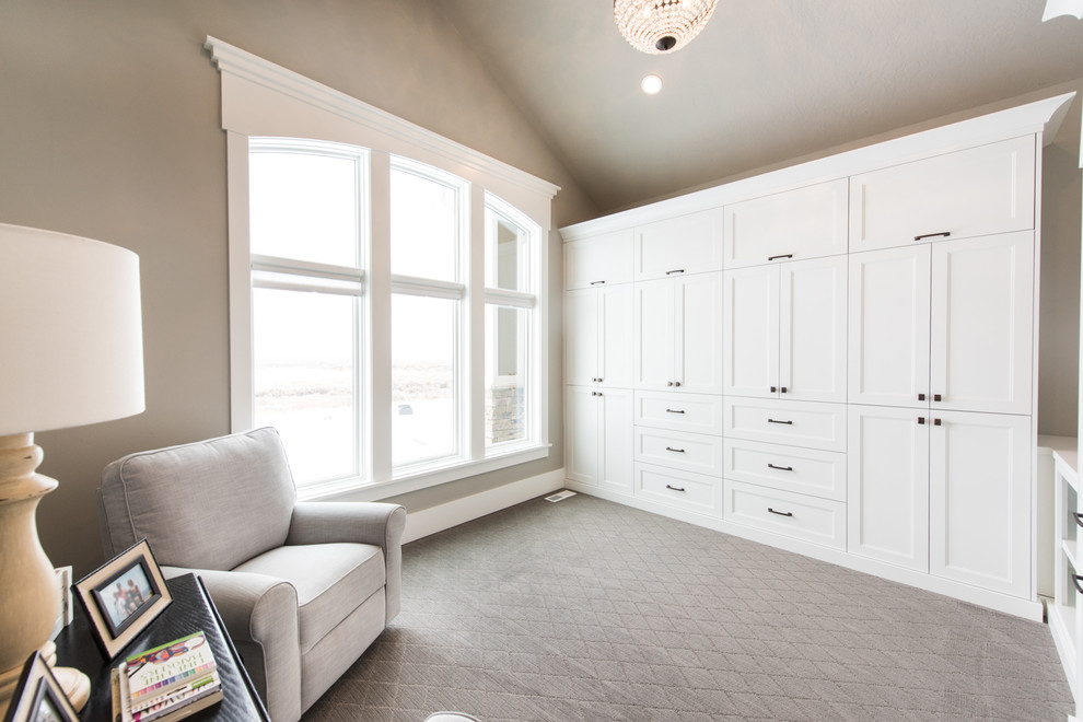Inspiration for a transitional storage and wardrobe in Salt Lake City with shaker cabinets and white cabinets.