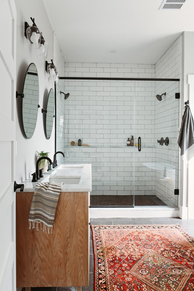 Small transitional master bathroom in Other with shaker cabinets, white tile, subway tile, porcelain floors, an undermount sink, quartzite benchtops, a hinged shower door, white benchtops, medium wood cabinets, a double shower, white walls and grey floor.