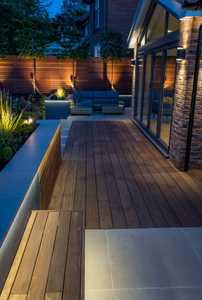 Design ideas for a small contemporary backyard partial sun garden for summer in Manchester with decking.