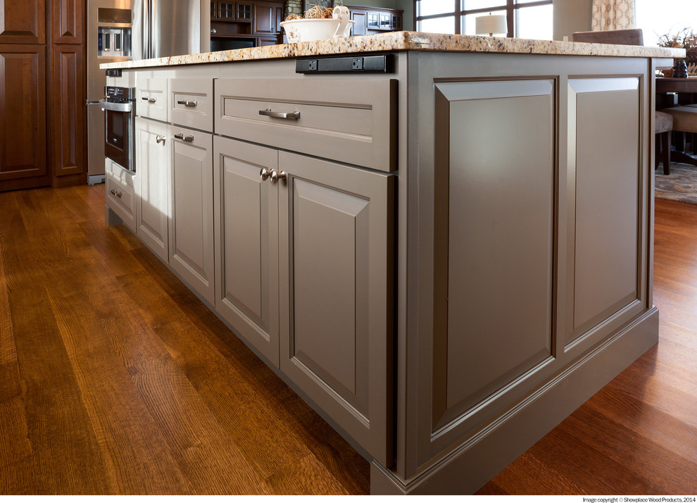Open concept kitchen - transitional u-shaped medium tone wood floor open concept kitchen idea with a double-bowl sink, raised-panel cabinets, dark wood cabinets, granite countertops, white backsplash, stainless steel appliances, an island and stone tile backsplash