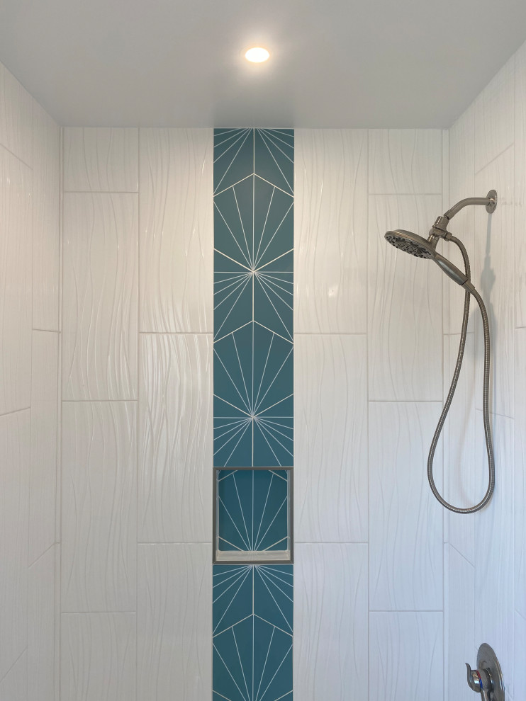 Inspiration for a small modern ensuite bathroom in Philadelphia with white cabinets, an alcove bath, a two-piece toilet, white tiles, ceramic tiles, white walls, porcelain flooring, a submerged sink, marble worktops, turquoise floors, a wall niche, a single sink and a freestanding vanity unit.