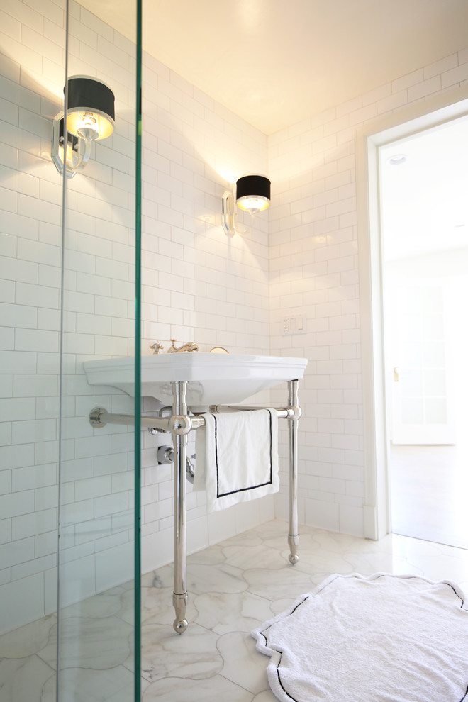 Design ideas for a traditional 3/4 bathroom in San Diego with an alcove tub, a shower/bathtub combo, a two-piece toilet, white tile, marble, white walls, marble floors and a pedestal sink.