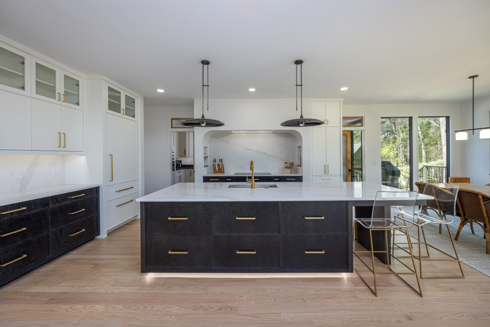 Open concept kitchen - large transitional medium tone wood floor open concept kitchen idea in Raleigh with an undermount sink, beaded inset cabinets, white cabinets, quartz countertops, white backsplash, quartz backsplash, paneled appliances, an island and white countertops