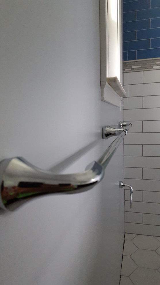 Inspiration for a small transitional 3/4 blue tile and glass tile porcelain tile alcove shower remodel in Cincinnati with recessed-panel cabinets, black cabinets, a two-piece toilet, gray walls, an undermount sink and quartz countertops