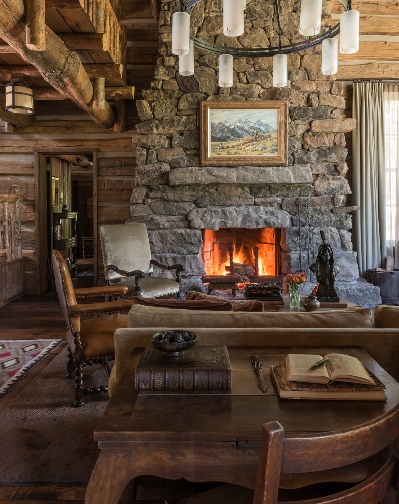 Photo of a country living room in Other with a standard fireplace and a stone fireplace surround.