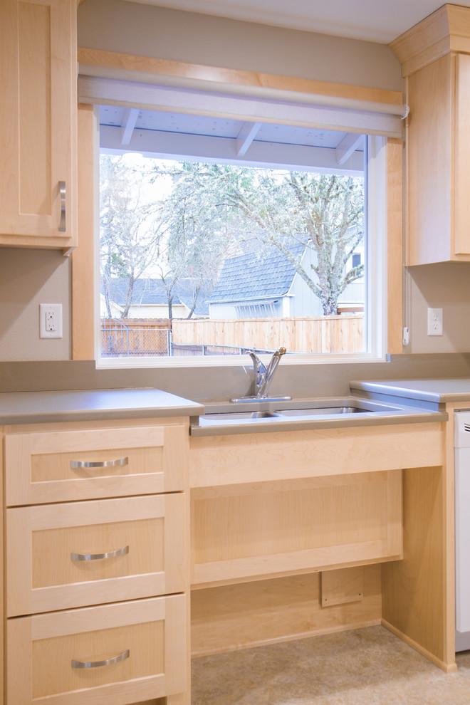 This is an example of a mid-sized transitional kitchen in Portland.