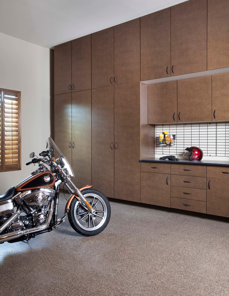 Photo of a contemporary one-car garage in Phoenix.