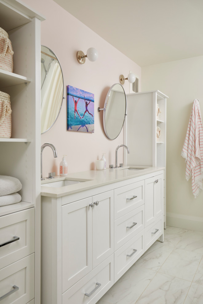Bathroom - large transitional kids' porcelain tile, white floor and double-sink bathroom idea in Toronto with shaker cabinets, white cabinets, a one-piece toilet, pink walls, an undermount sink, white countertops and a freestanding vanity
