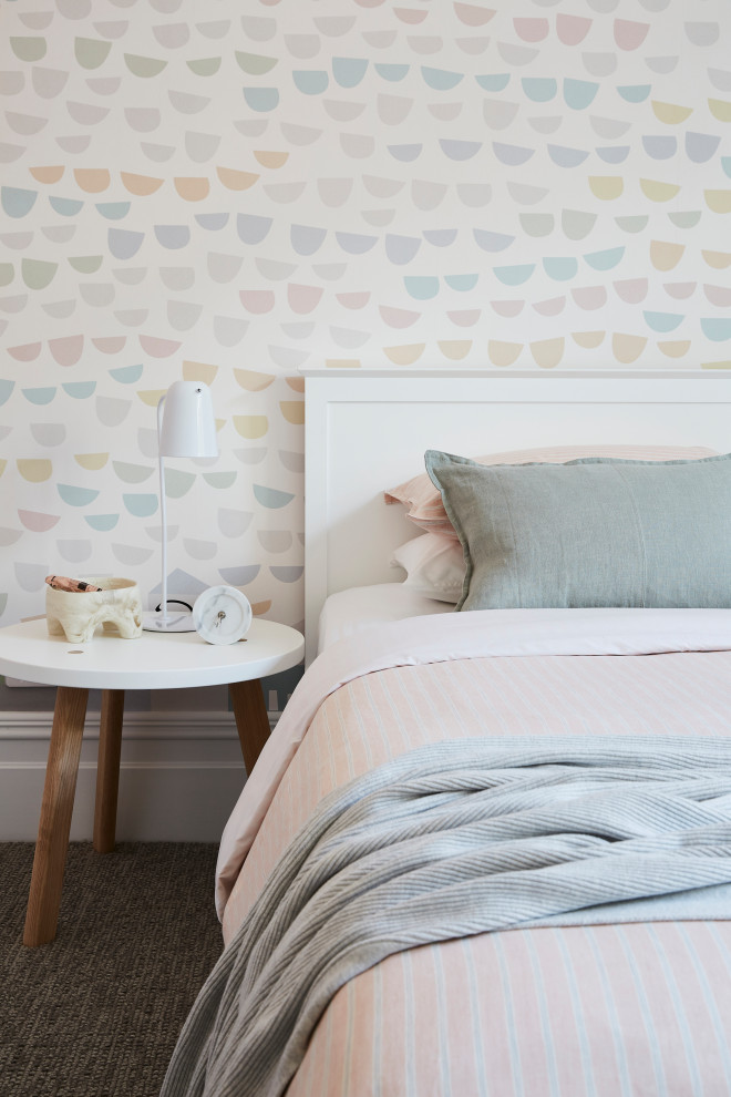 Inspiration for a large transitional kids' room for kids 4-10 years old and girls in Sydney with pink walls, carpet and grey floor.