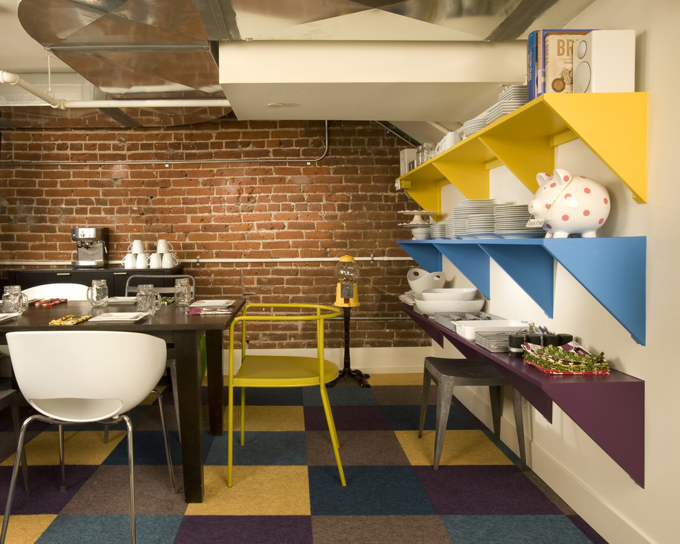 This is an example of an industrial dining room in Denver with cork floors and multi-coloured floor.