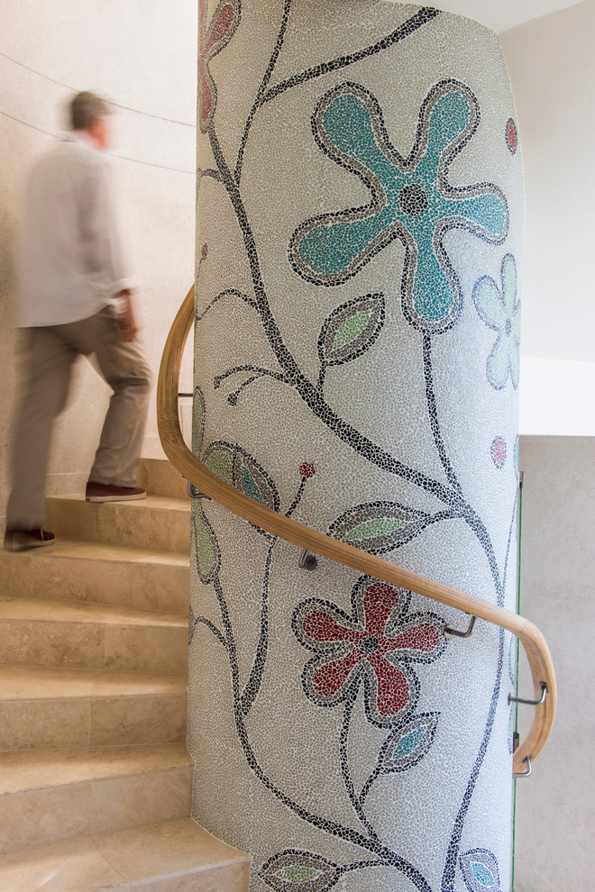 This is an example of a contemporary tile spiral staircase in Brisbane with tile risers.