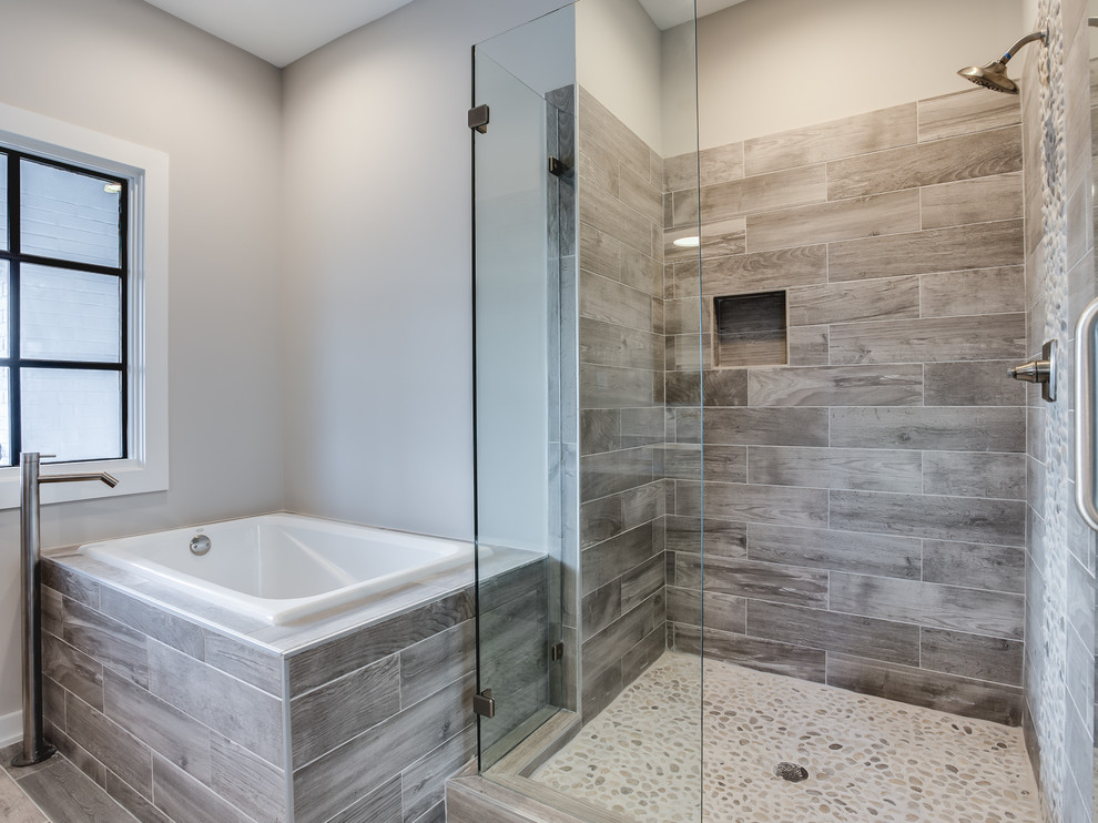 This is an example of a transitional kids bathroom in Other with shaker cabinets, a freestanding tub, a corner shower, black tile, porcelain tile, grey walls, porcelain floors, a vessel sink and engineered quartz benchtops.