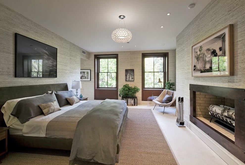 This is an example of a contemporary bedroom in New York with travertine floors.