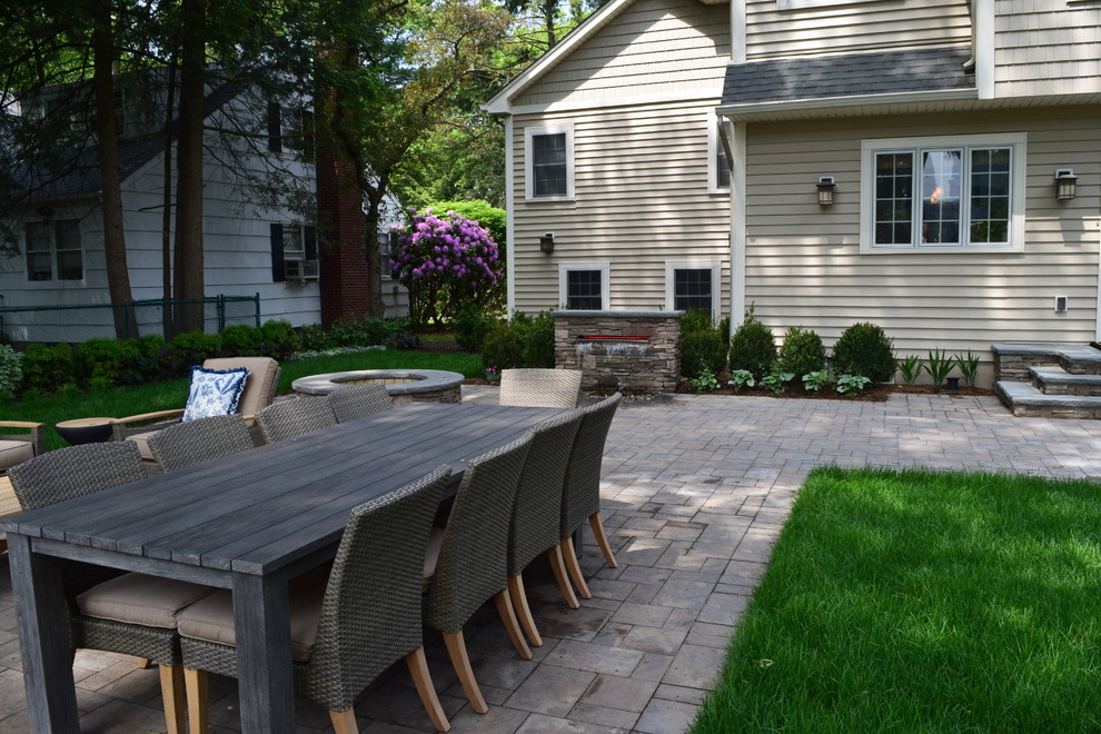 Patio kitchen - mid-sized rustic backyard concrete paver patio kitchen idea in New York with no cover