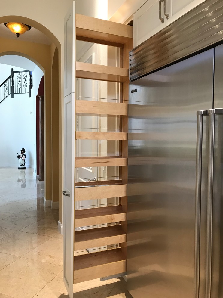 Example of a large transitional kitchen design in Miami with a farmhouse sink, shaker cabinets, white cabinets, quartz countertops, gray backsplash, glass tile backsplash, stainless steel appliances, an island and multicolored countertops