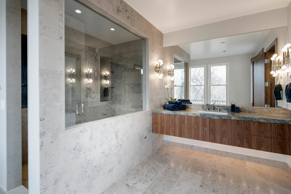 Design ideas for a large contemporary master bathroom in Denver with an undermount sink, flat-panel cabinets, medium wood cabinets, granite benchtops, a double shower, a one-piece toilet, gray tile, stone tile, grey walls and limestone floors.