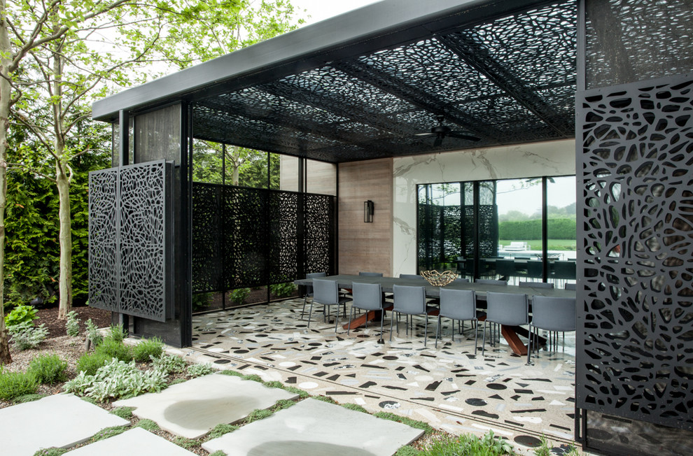 Midcentury patio in New York with a pergola and tile.