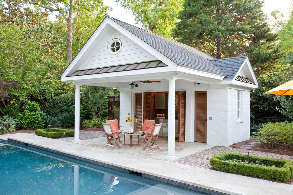 Inspiration for a mid-sized modern rectangular lap pool in Charleston with natural stone pavers.