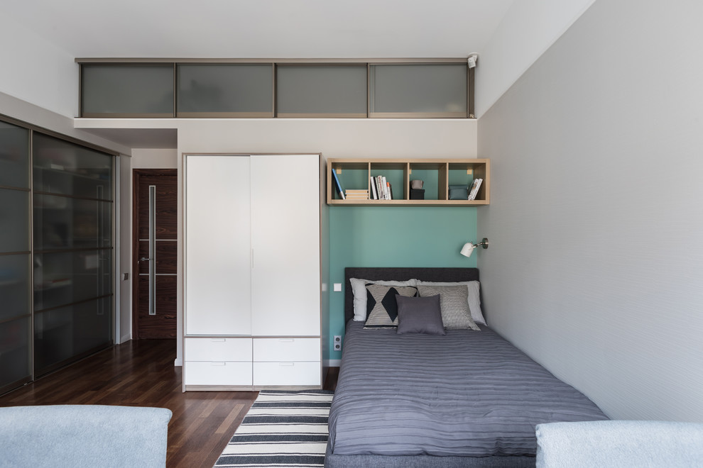 Photo of a scandinavian kids' room for boys in Saint Petersburg with grey walls, dark hardwood floors and brown floor.