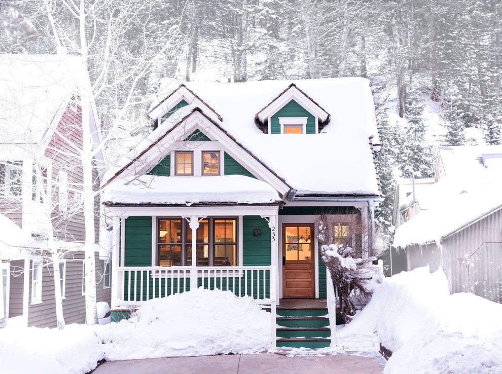 Elegant green two-story exterior home photo in Other