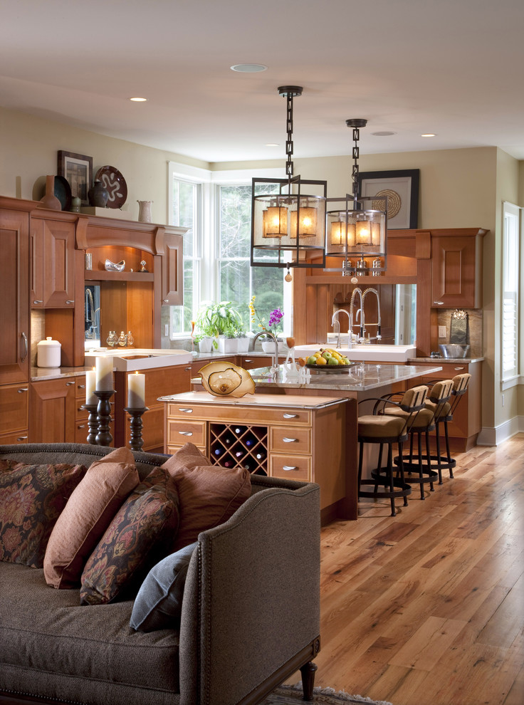 Inspiration for a large traditional l-shaped open plan kitchen in Milwaukee with shaker cabinets, medium wood cabinets, medium hardwood floors, with island and brown floor.