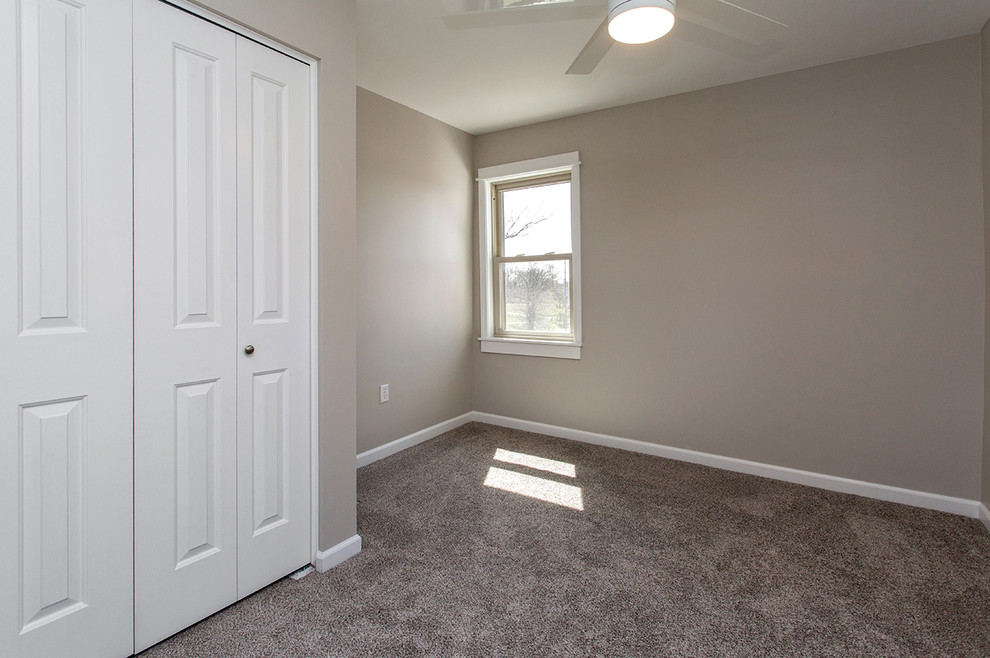 Photo of a small country master bedroom in Other with grey walls, carpet and no fireplace.
