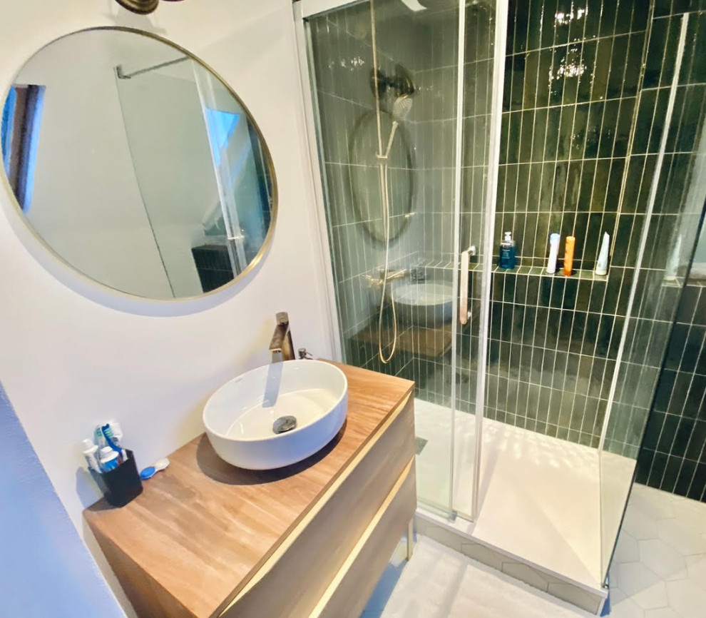 This is an example of a small scandinavian shower room bathroom in Nantes with a corner shower, green tiles, ceramic tiles, white walls, ceramic flooring, a console sink, laminate worktops, white floors, a sliding door and a single sink.