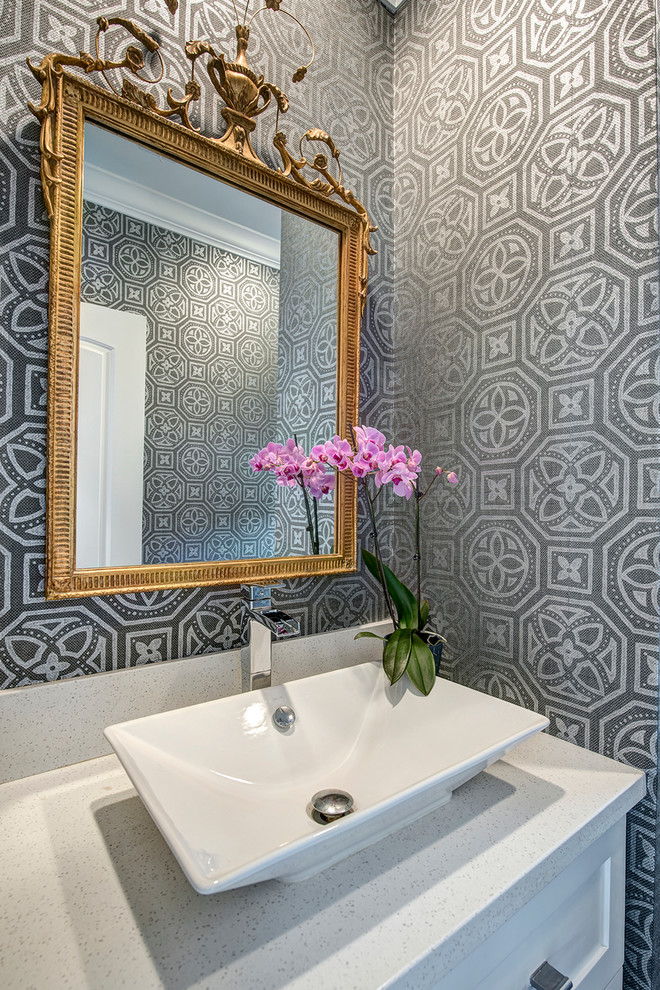 This is an example of a transitional powder room in Houston.