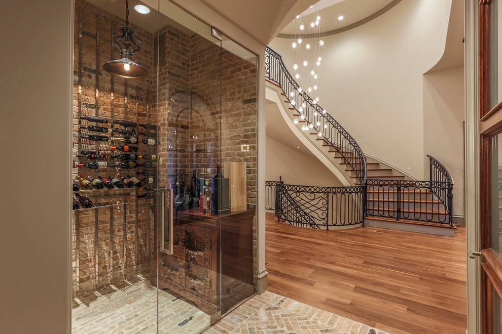 This is an example of a traditional wine cellar in Dallas with brick floors, storage racks and beige floor.