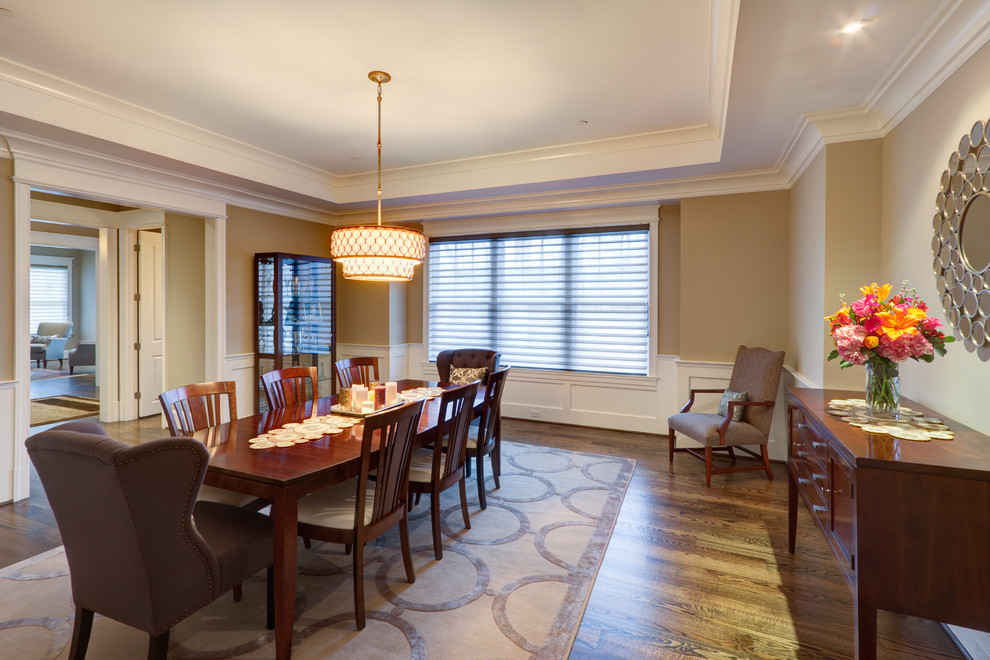 Transitional medium tone wood floor enclosed dining room photo in DC Metro with gray walls