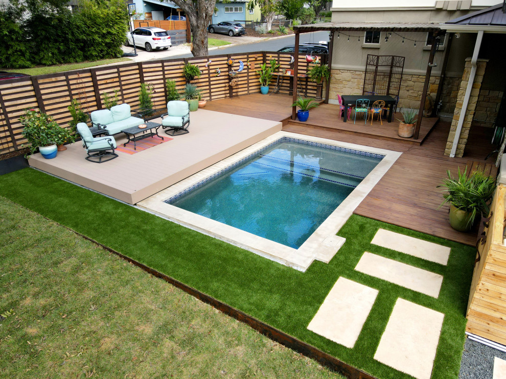 Inspiration for a small side yard pool remodel in Austin