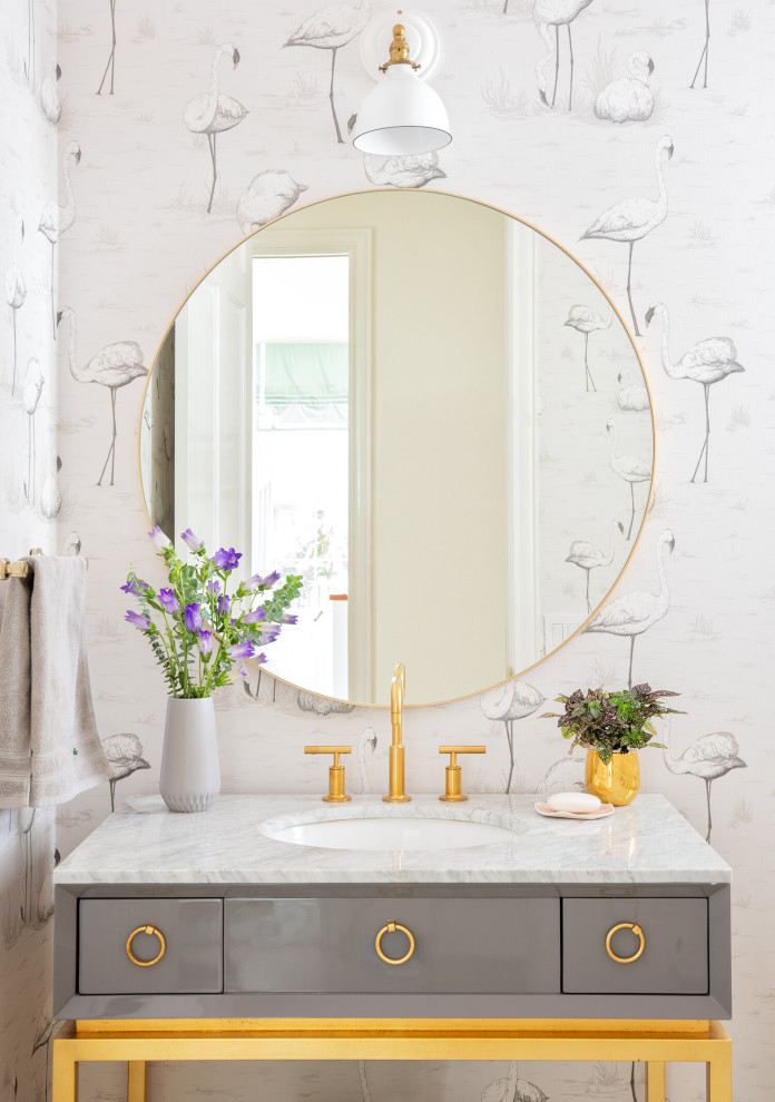 This is an example of a mid-sized mediterranean powder room in Tampa with open cabinets, an undermount sink, marble benchtops, white benchtops and a built-in vanity.