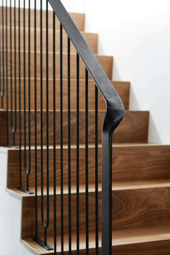 Inspiration for a small wooden straight metal railing staircase remodel in Toronto with wooden risers