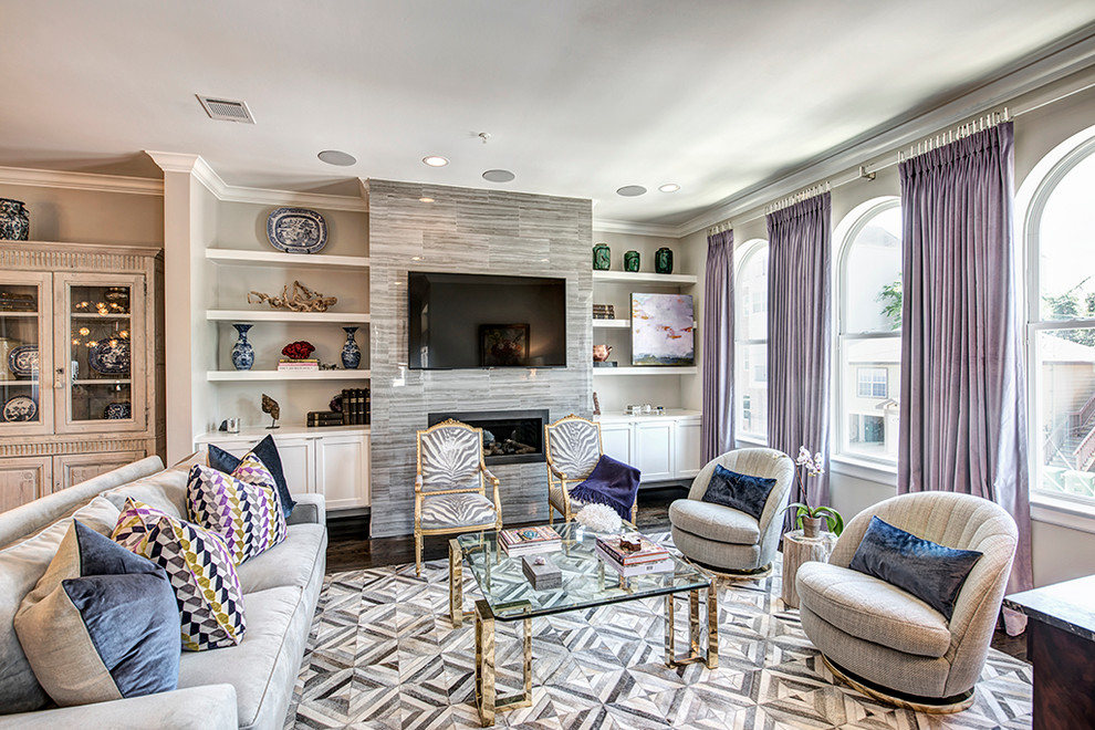This is an example of a large eclectic open concept family room in Houston with grey walls, dark hardwood floors, a standard fireplace and a stone fireplace surround.