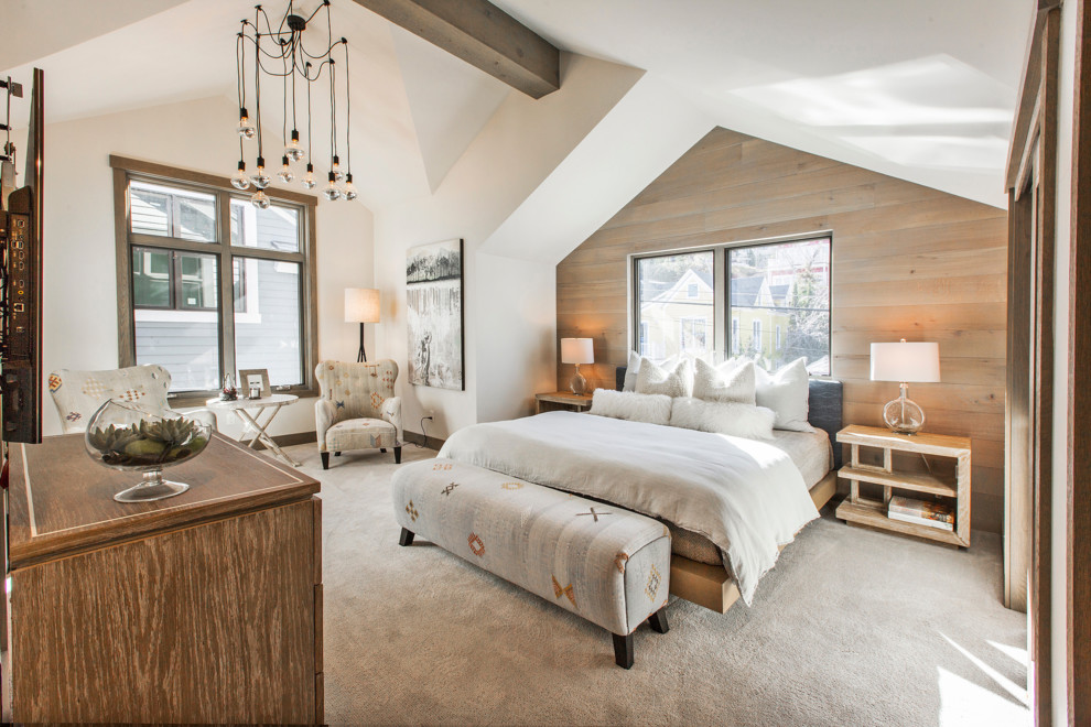 This is an example of a mid-sized country master bedroom in Salt Lake City with carpet, white walls and beige floor.