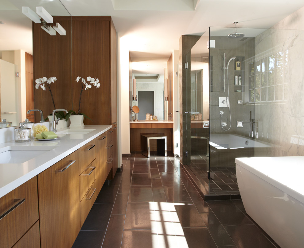 Inspiration for a mid-sized contemporary master bathroom in Detroit with an undermount sink, flat-panel cabinets, light wood cabinets, engineered quartz benchtops, a freestanding tub, a corner shower, ceramic tile, white walls and ceramic floors.