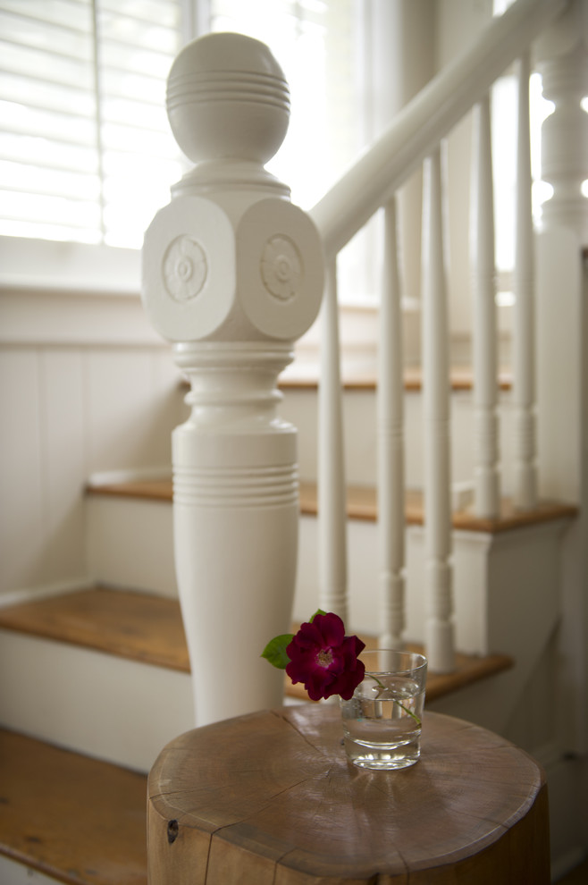 Mid-sized traditional wood l-shaped staircase in Boston with painted wood risers.