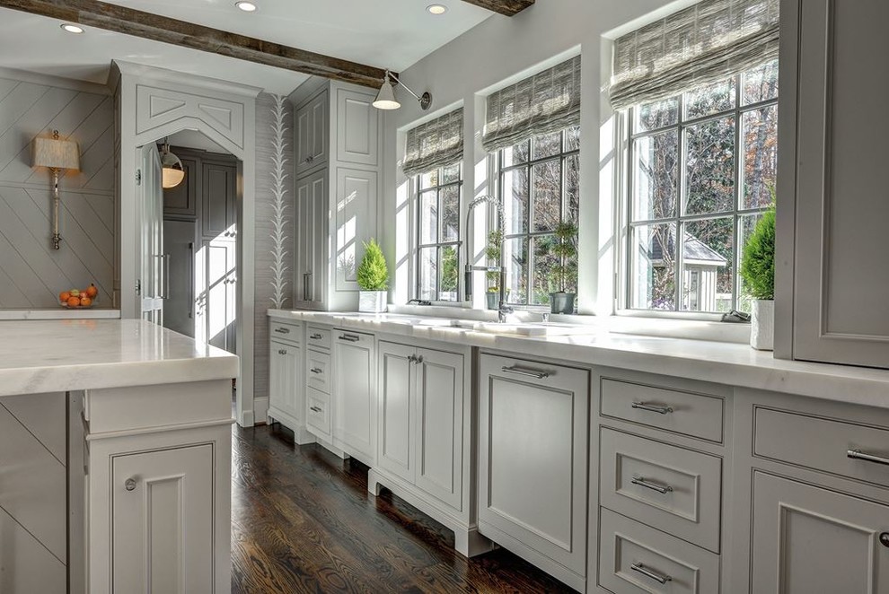 Inspiration for a large transitional l-shaped dark wood floor kitchen pantry remodel in Denver with a drop-in sink, shaker cabinets, white cabinets, laminate countertops, multicolored backsplash, mosaic tile backsplash, stainless steel appliances and an island
