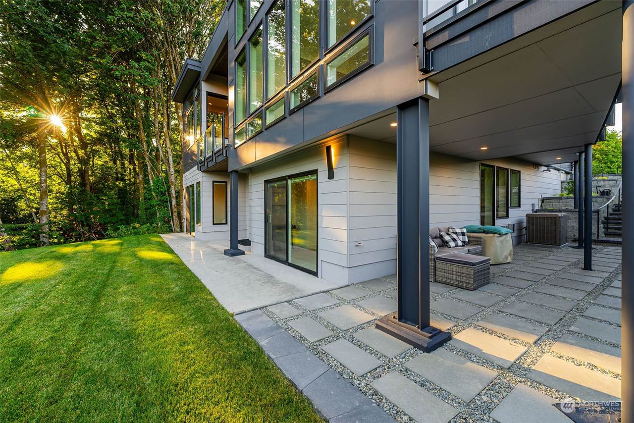 This contemporary custom home was designed to emphasize clean architectural lines, expansive natural light, and a strong connection between the indoor and outdoor living spaces. Large floor-to-ceiling