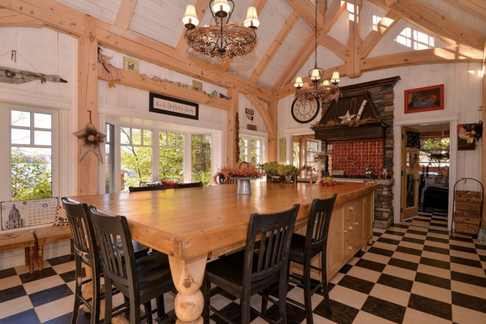 Large mountain style galley dark wood floor open concept kitchen photo in Boston with an undermount sink, shaker cabinets, white cabinets, granite countertops, stainless steel appliances and an island