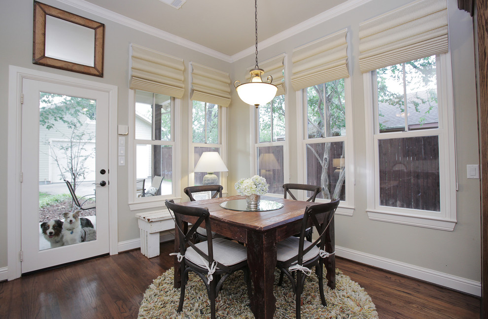 Photo of an eclectic dining room in Dallas with grey walls and dark hardwood floors.