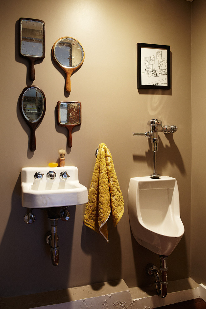 Inspiration for an eclectic powder room in Los Angeles with a wall-mount sink and an urinal.