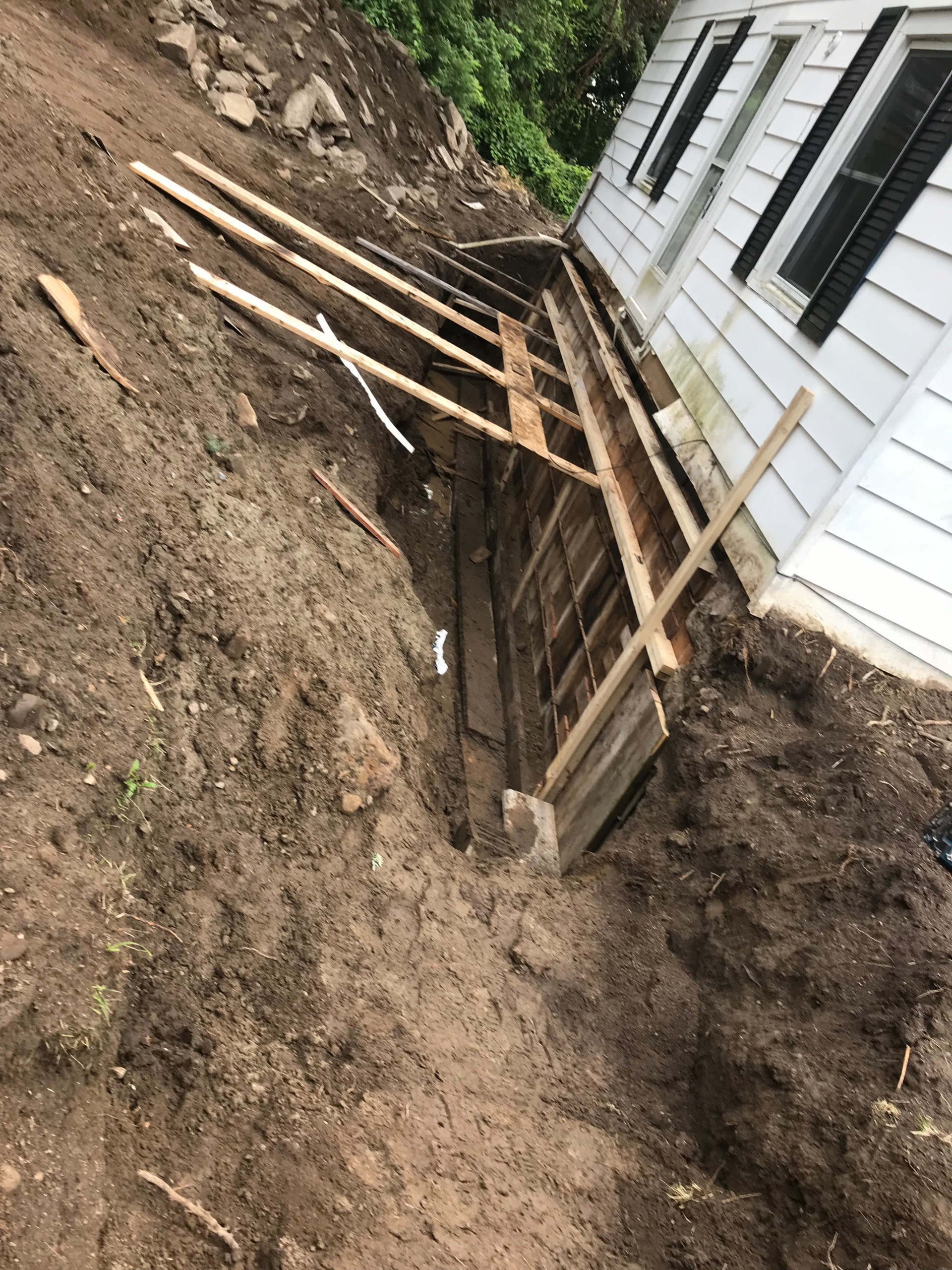 A new reinforced foundation wall was then formed and securely tied into the existing structure using rebar.
