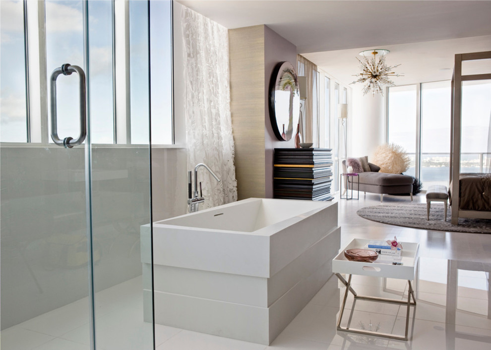 Photo of a modern master bathroom in Miami with a freestanding tub.